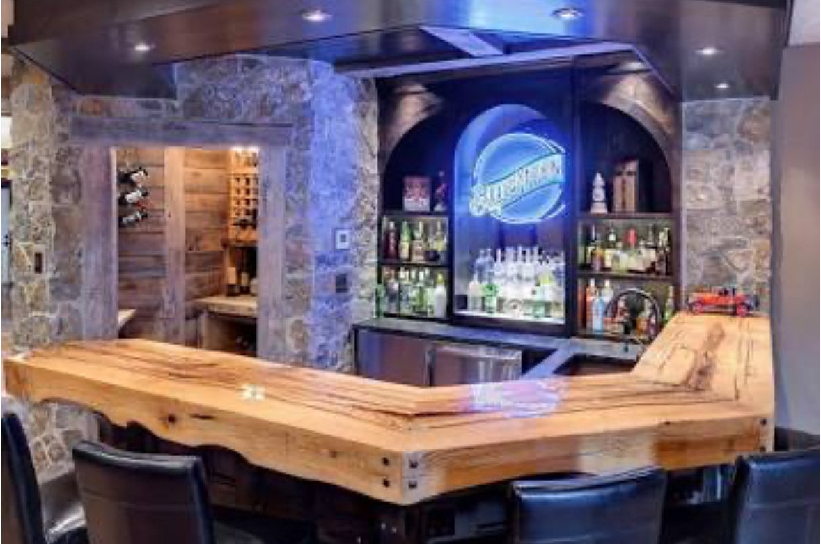 Stunning live edge bar made with wood slabs, and food safe finish | Mr. Countertops
